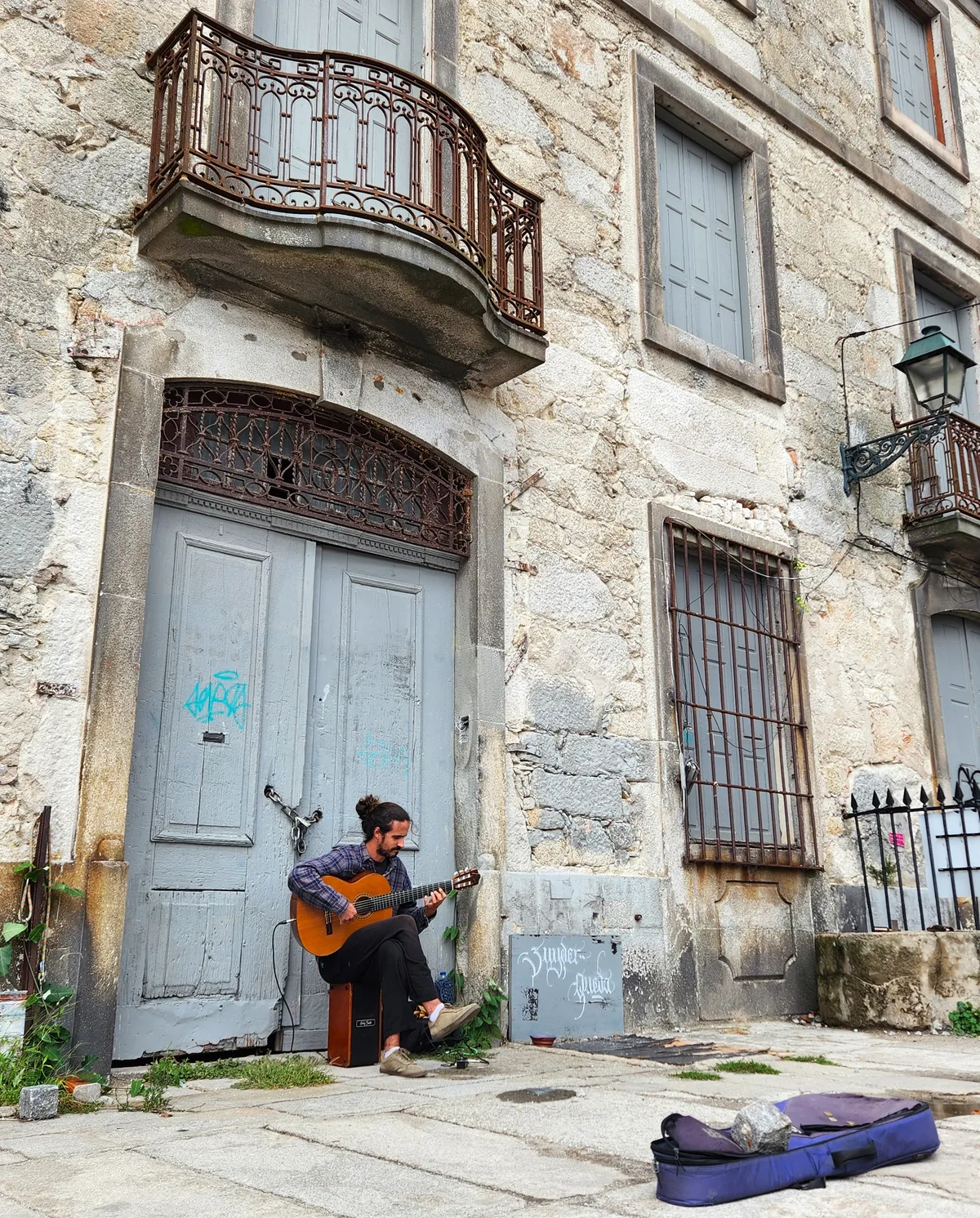 Street guitarist performing in Porto, Portugal